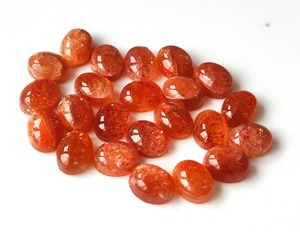 Piedra solar naranja natural cabujón ovalado suelto 3x5mm-10x14mm piedra preciosa trasera plana para la fabricación de joyas - Product Image 1