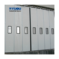 Puerta Industrial Plegable Automática de Acero Resistente con Panel Sándwich Aislante, Impermeable y Ahorro Energético