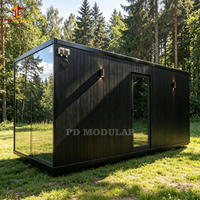 Cabane préfabriquée noire directement de l'usine pour parcs de vacances, complexes hôteliers en plein air, chambres d'hôtes et locations.