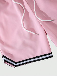 กางเกงขาสั้นปักลายสำหรับผู้ชายและผู้หญิงแฟชั่นเรียบง่ายสีพื้นเพื่อความสบายและสไตล์ในชีวิตประจำวัน - Product Image 2