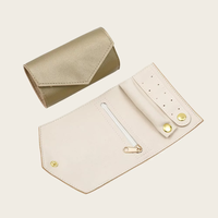 Nouveau voyage de luxe en cuir PU bijoux sacs de rangement organisateur de voyage rouleau pour collier Bracelet boucles d'oreilles anneau avec Logo personnalisé
