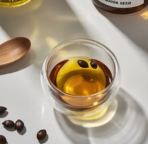 Approvisionnement d'usine 100% huile de jojoba biologique pure huile de support pressée à froid pour les formulations de soins de la peau et de soins capillaires approvisionnement en vrac de l'Inde - Product Image 2