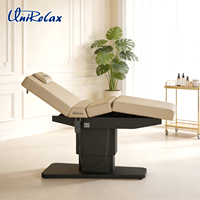 Lit de beauté facial moderne en PVC avec mécanisme de levage électrique, 3 moteurs, design pliable pour usage en salon