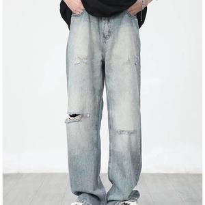 กางเกงยีนส์ผู้ชายทรงเฟลร์แบบวินเทจฟอกสี ขาดเซอร์ๆ สไตล์ดิสเทรส รูขาดๆ คุณภาพดี รับผลิตแบบ OEM ขายส่ง - Product Image 4