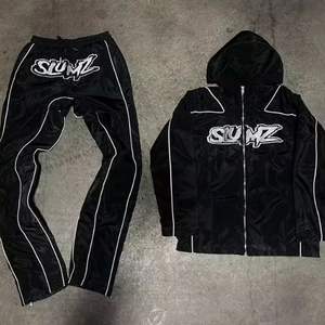 ชุดแจ็กเก็ตกางเกงกันลมสำหรับผู้ชายชุดวอร์มกันลมผ้าไนลอนผลิตจากโรงงานโดยตรง - Product Image 3