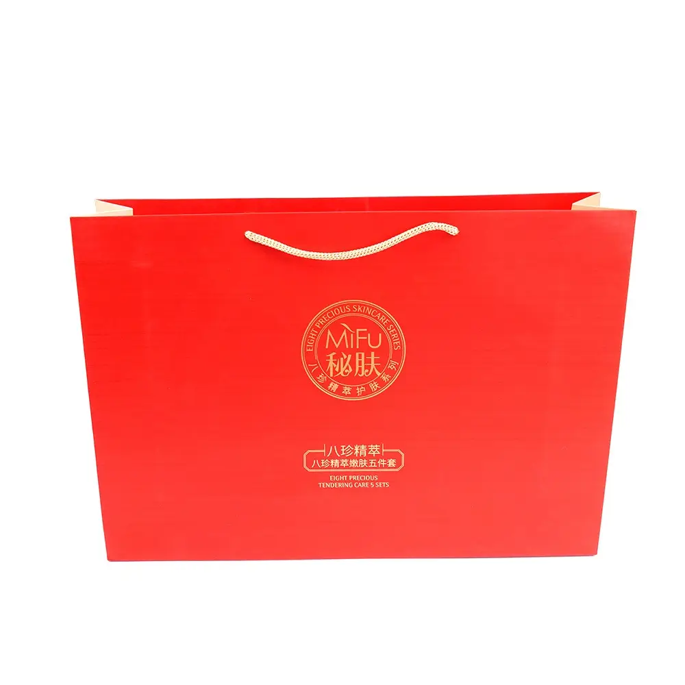 Sacs en papier bon marché d'usine Emballage de shopping de luxe de haute qualité Sac cadeau en papier de vente au détail de boutique rouge personnalisé