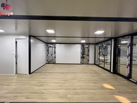 Cabine modulaire préfabriquée de luxe de 20 pieds 40 pieds Maison en paquet plat de 2 chambres à coucher fabriquée à partir de conteneurs Maison en conteneur moderne extensible pour hôtel