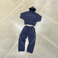 Chaqueta y pantalones de chándal de nailon a prueba de viento impermeables reflectantes de gran tamaño con cremallera de poliéster personalizados Conjunto unisex de chándal de nailon