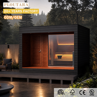 Sauna extérieur PLOUTARA, cabane en bois noir, toit plat, porte à persiennes, façade vitrée, éclairage LED, OEM pour villa, resort, spa