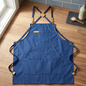 Tablier classique bleu en toile sans manches, robuste et réutilisable, avec taille réglable et plusieurs poches pour le rangement des produits de nettoyage - Product Image 1