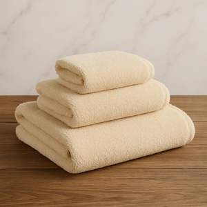 Serviette de bain en coton biologique 100% ivoire, certifiée GOTS, douce, moelleuse, absorbante, séchage rapide, écologique, qualité spa de luxe - Product Image 1