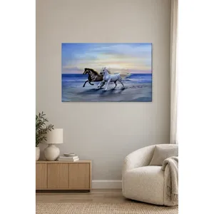 Impression sur toile de chevaux noirs et blancs courant sur la plage par Fida - Product Image 3