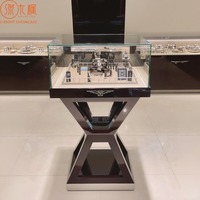 Tables d'exposition de montres modernes avec éclairage LED, vitrines de luxe pour bijoux et montres, fabrication sur mesure par le fabricant source.