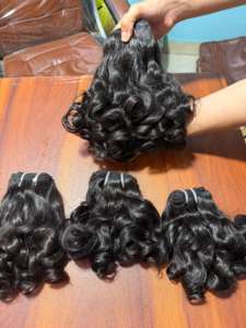 Venta al por mayor 100% Natural crudo hinchable ondulado indio Remy paquetes de cabello humano extensiones de cabello suave grueso cutícula alineada cabello proveedor - Product Image 2