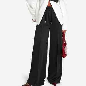 Vente en gros de pantalons de jogging noirs personnalisés en tricot avec ourlet fendu pour femmes, jambe droite, polaire éponge, doux au toucher, pantalons pour femmes - Product Image 1