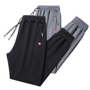 Fitness Wear Transpirable Alta calidad Hombres Peso ligero Cintura media OEM ODM Pantalones de chándal Tela polar Ropa regular Hombres Joggers - Product Image 1