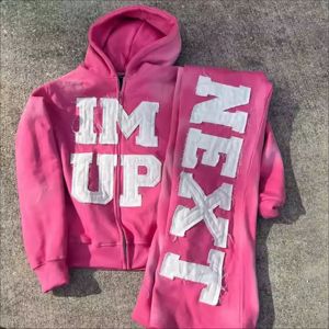 Conjunto de chándal de dos piezas unisex personalizado de talla grande, de tejido grueso y color liso, con sudadera con capucha y pantalones acampanados con dobladillo sin rematar - Product Image 1