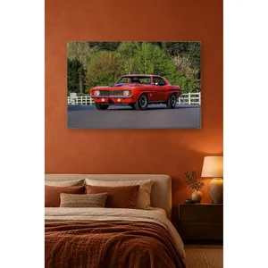 Impression sur toile de Fida Orange Camaro devant des clôtures blanches - Product Image 1