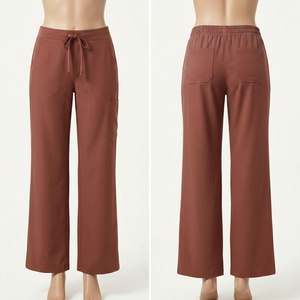 Pantalon de travail pour femme en polyester et élasthanne de haute qualité, 245 GSM, orange, extensible, avec poches utilitaires, broderie de logo personnalisée - Product Image 5
