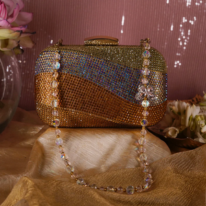White pearl and rhinestone clutch with wavy design and gold chain for bridal events available at wholesale prices. - Product Image 3