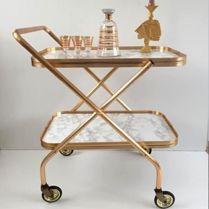 Vintage gold bar cart with elegant curved metal frame and large spoked <b>wheels</b>. Available at wholesale price. - Product Image 2