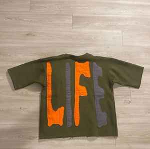 เสื้อยืดผ้าฝ้ายปักลายโลโก้สำหรับผู้ชาย - Product Image 6