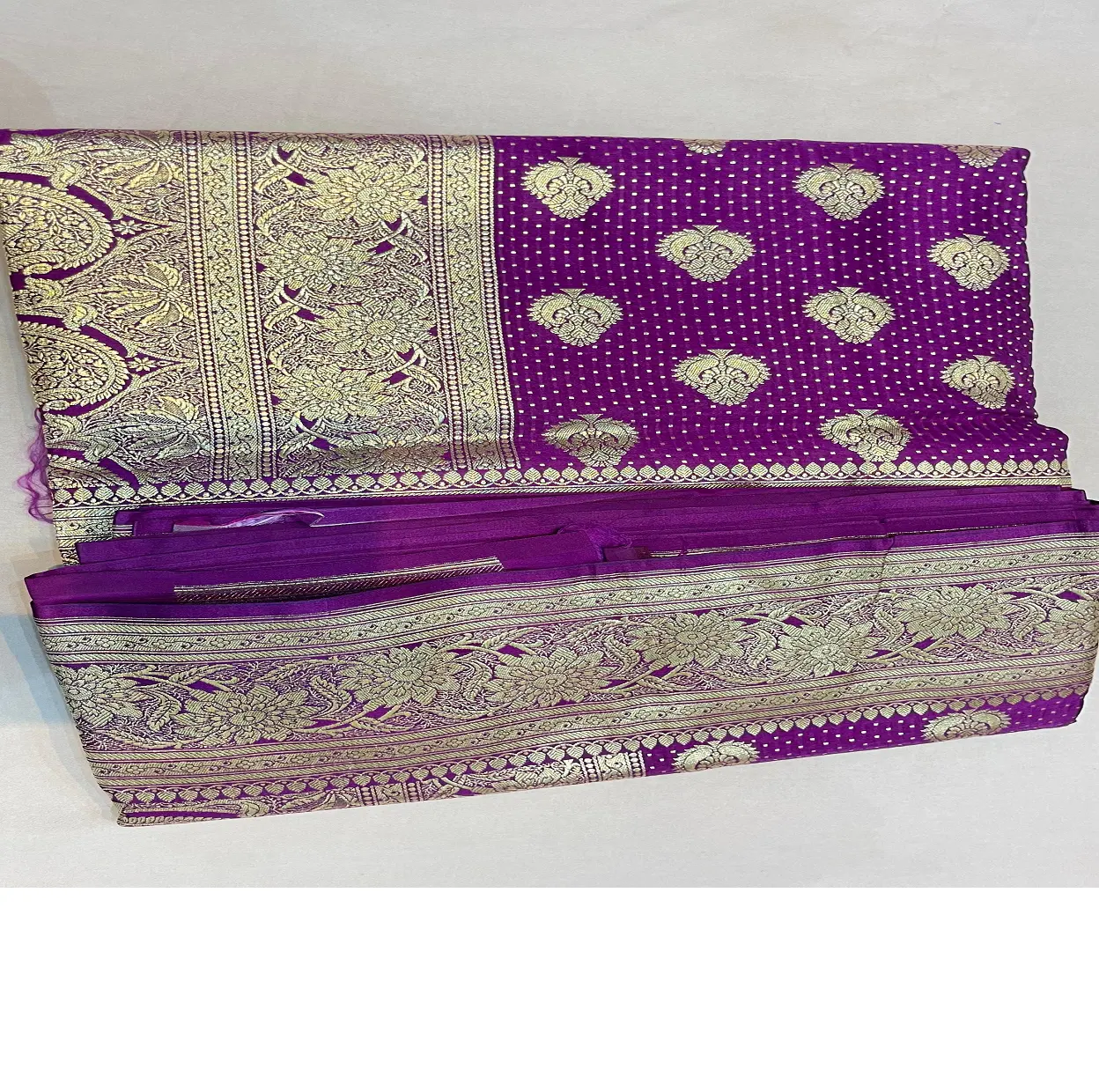 custom made brocade silk sarees made with gold borders ideal for resale by clothing stores in purple colour base fabric.