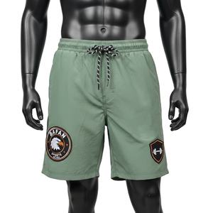 กางเกงว่ายน้ำชาย 150 GSM แห้งเร็ว โพลีเอสเตอร์ไมโครไฟเบอร์ สีเขียวมะกอก เอวยางยืด ปักโลโก้ตามสั่ง - Product Image 1