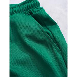 Pantalones cortos de baloncesto verdes para hombre con capa inferior blanca, ribete blanco y negro, transpirables, de secado rápido, ropa deportiva para entrenamiento en el gimnasio - Product Image 4