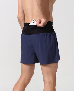 Pantalones cortos elásticos de nailon suave deportivos con logotipo personalizado de secado rápido y bolsillo de malla de cintura alta para correr sin costuras - Product Image 2