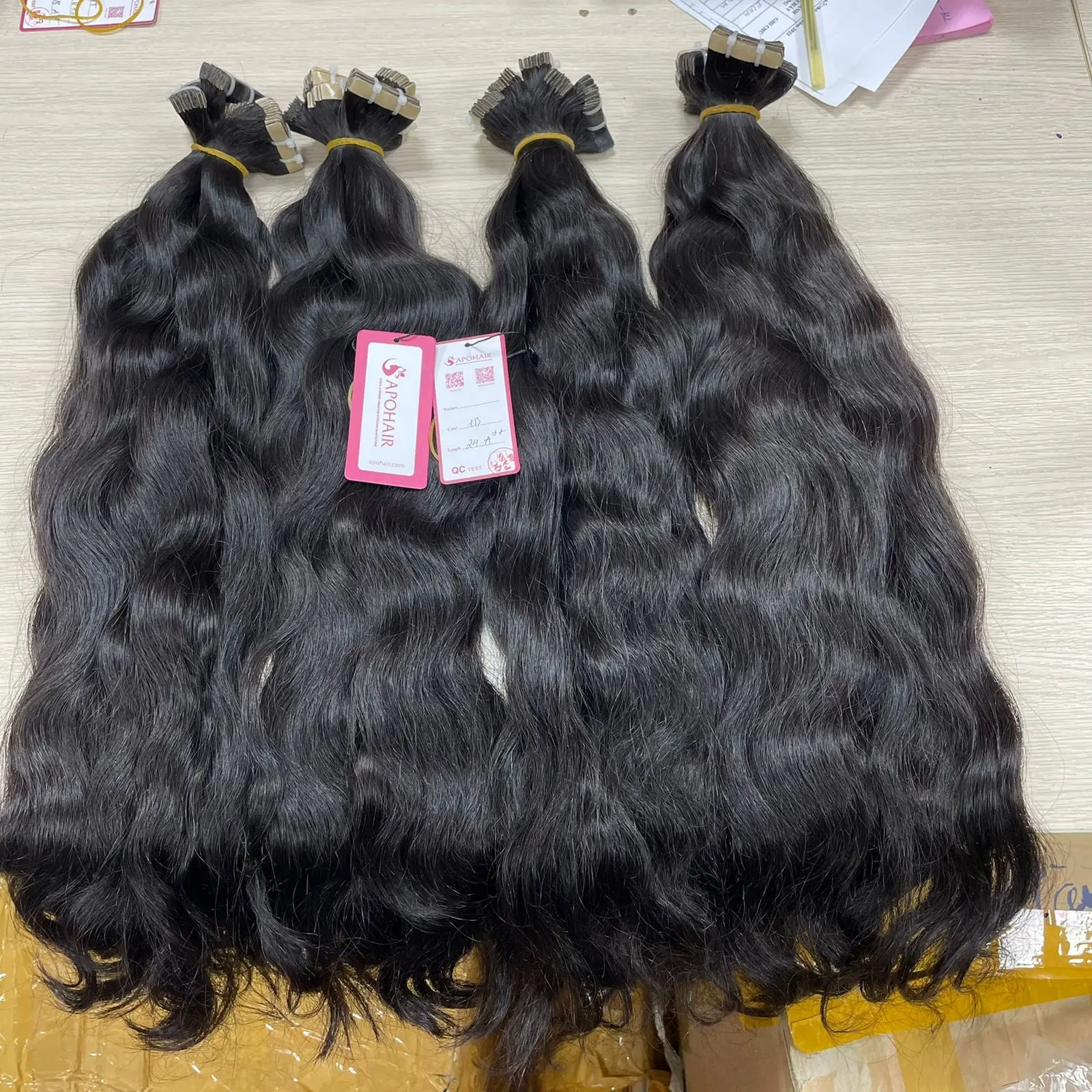 THE BEST QUALITY TAPE NATURAL WAVY HAIR BLACK COLORS AND NO TANGLE NO SHEDDING FROM TIANA APOHAIR