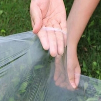 Film de paillage PE transparent perforé avec trous, résistant aux UV, durable, blanc, pour la culture précoce des cultures, réchauffement du sol agricole