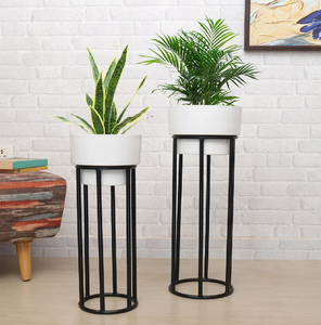 Minimalist Duo: Set of two tall white ceramic-look planters on sleek black metal <b>stands</b> The perfect modern accent for any corner - Product Image 1