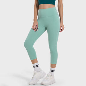 Collants de gymnastique athlétiques pour femmes 3/4 longueur taille haute Capris bout à bout couleurs unies sans couture avant beurre tissu poches sans couture - Product Image 3