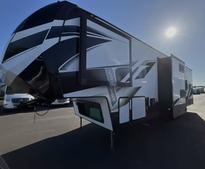 Modern Used 2021 Dutchmens Voltage 3615 Travel <b>Trailer</b> with 8 Person Capacity and Independent Suspension Ready to Ship - Product Image 1