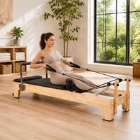 Reformer Pilates Professionnel Haut de Gamme en Bois Naturel avec Poulie Réglable et Plateforme Rembourrée pour Entraînement Complet du Corps