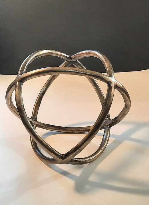 Minimalist aluminium sculpture with visual flow and brushed surface perfect for professional spaces or art gifting