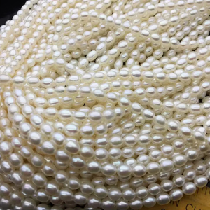 AAA de alta calidad 5,5-6mm * 6-7mm perlas de agua dulce ovaladas blancas cuentas de arroz hebra completa perlas sueltas de agua dulce - Product Image 1