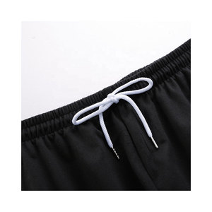 Vente en gros Ensemble fitness décontracté d'été pour hommes Ensemble deux pièces t-shirt et short à manches courtes surdimensionné à motif uni - Product Image 3