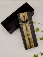 Boîte cadeau rectangulaire longue de luxe noire personnalisée en papier d'art avec revêtement UV, bande en feuille d'or gaufrée et ruban de satin pour la Saint-Valentin et les anniversaires