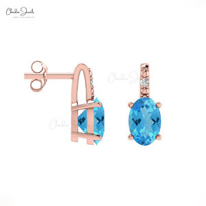 Productos de tendencia para vender 6x4mm Topacio azul suizo 14K Juego de puntas de oro sólido Pendientes de diamantes redondos Distribuidores al por mayor - Product Image 1