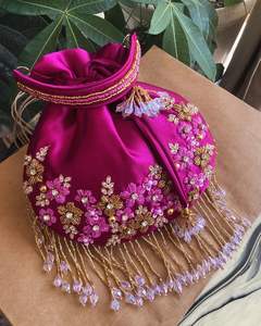 2025@Women's Party-wear Wrist Purple POTLI <b>Bags</b> on silk Fabric with Embellished Crystal Glass Beads, <b>Pearls</b> embroidery work - Product Image 1