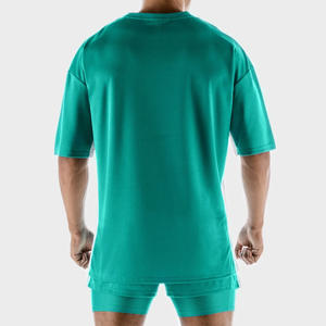 เสื้อยืดผ้าฝ้าย100% สำหรับผู้ชายทรงหลวมดีไซน์โอเวอร์ไซส์ลำลองพิมพ์ลายปักโลโก้คุณภาพสูง - Product Image 2