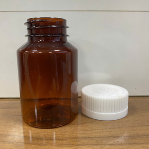 Botella de Medicina de plástico ámbar de 2 oz con tapa acanalada blanca Botella farmacéutica PET Hecho en Vietnam Tapa resistente a los niños - Product Image 2