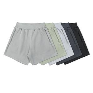 Shorts de gymnastique pour hommes avec logo personnalisé de haute qualité vente en gros de shorts de basket-ball en coton avec logo de broderie à fermeture éclair élastique mi-taille solide - Product Image 1