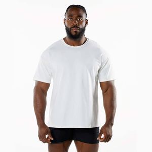T-shirts unisexes personnalisés OEM 100% coton T-shirt blanc uni décontracté style long manches courtes coupe surdimensionnée avec logo imprimé stock d'hommes - Product Image 1