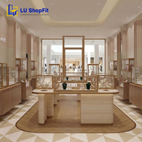 Vitrine LED en verre pour bijouterie, style effet pierre, design intérieur de boutique de luxe léger avec présentoirs de diamants