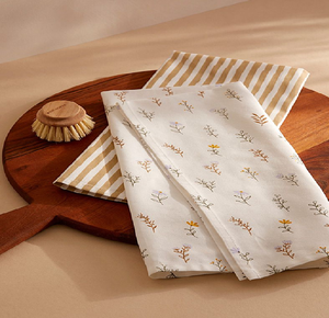 Handheld set of pastel botanical and strawberry print cotton dish towels. Available at wholesale prices. - Product Image 2