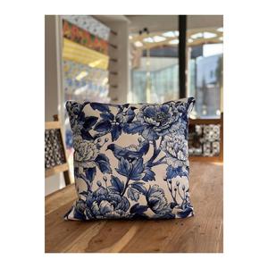 Copricuscino a tema con giardino fiorito blu e uccelli