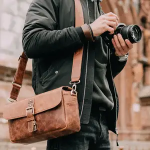 畅销皮革斜挎包相机包无反光镜即时DSLR相机男女通用旅行包